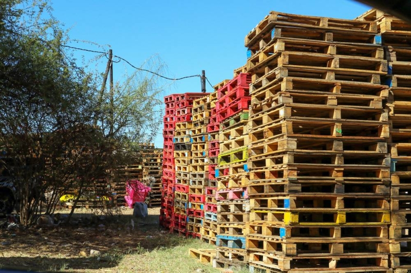 CRIME SCENE: The lifeless body of Botho Gabotsalwe was found by these pallets