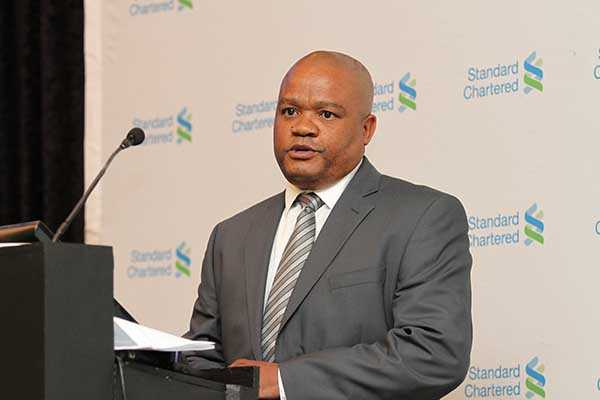 StanChart H1 profits tumble