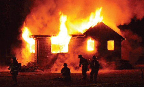 FIREMAN BURNS OWN HOUSE